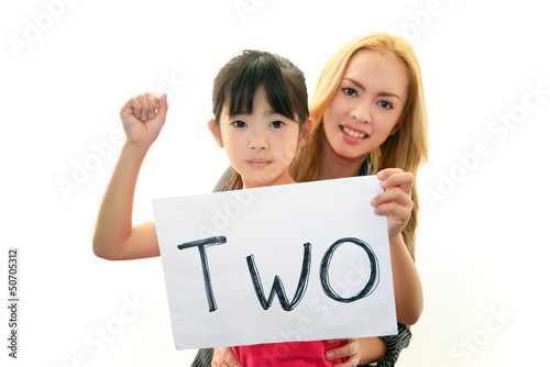 Obraz na płótnie 笑顔の外国人教師と女の子 w salonie