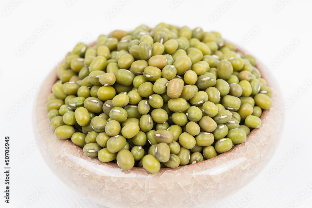 Green mung beans in bowl on white background Green mung beans in bowl on white background