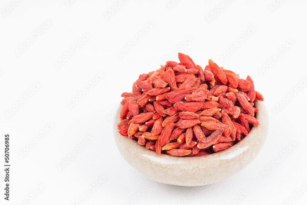 dried wolfberry fruit in bowl on white background dried wolfberry fruit in bowl on white background
