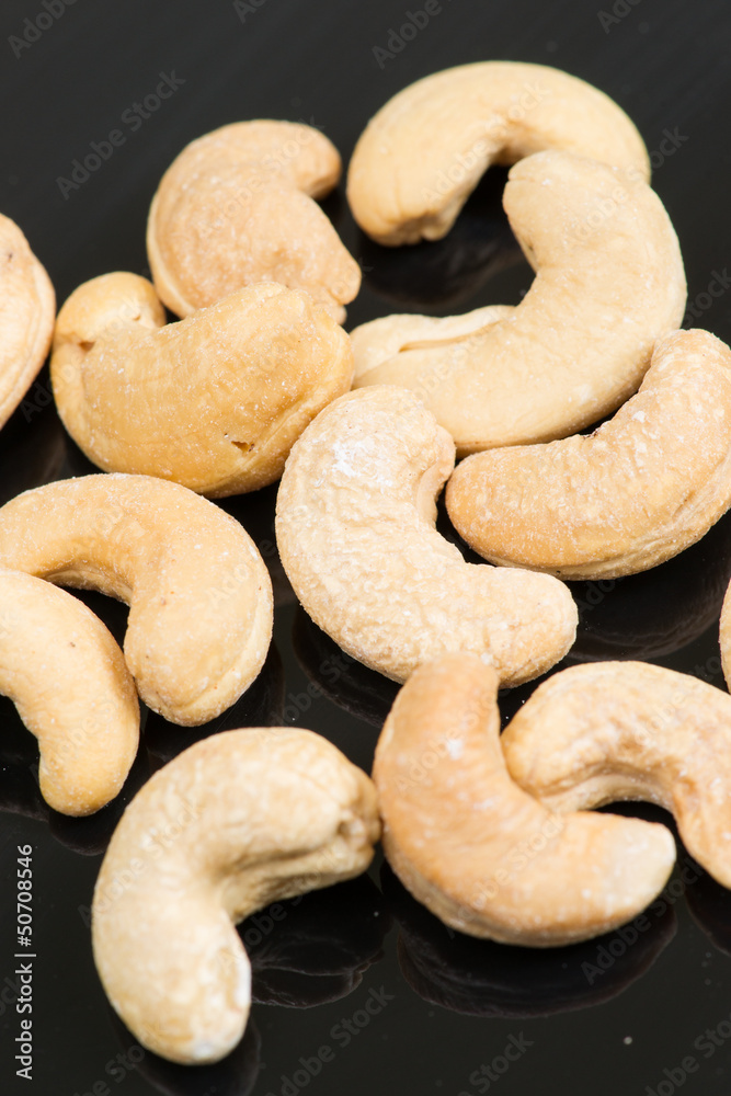 cashew nuts on black background