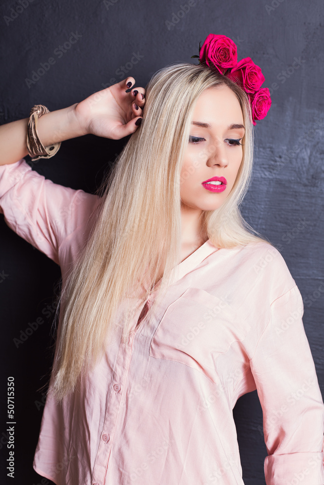 Portrait of beautiful young blond haired woman in shirt