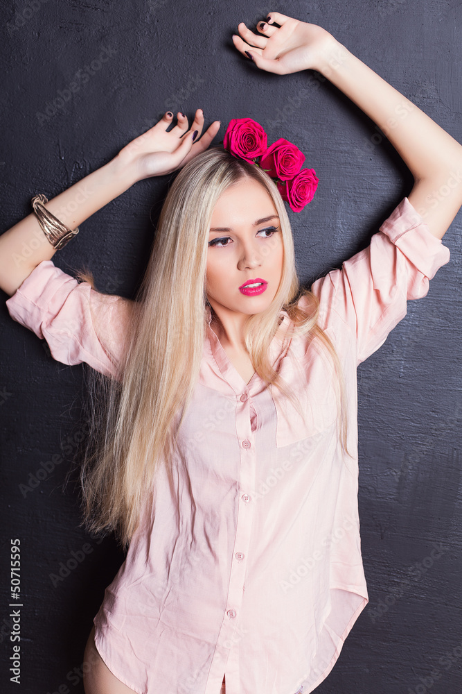 Fototapeta premium Portrait of beautiful young blond haired woman in shirt