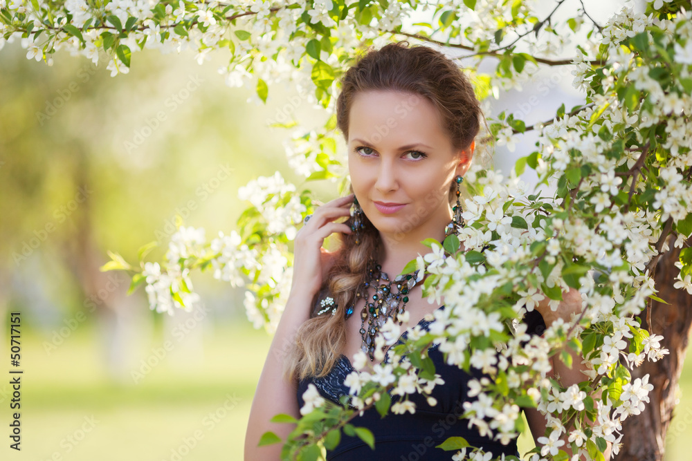 Beautiful woman in a spring garden Beautiful woman in a spring garden