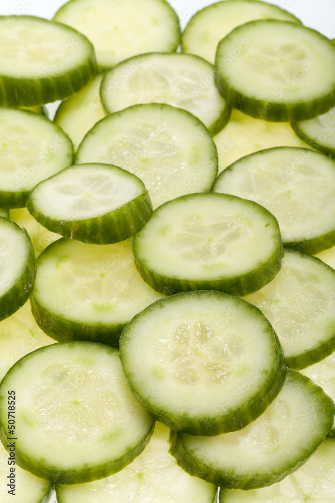 Freshly sliced cucumber isolated on white background Freshly sliced cucumber isolated on white background