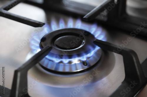 gas stove, focus on center burner