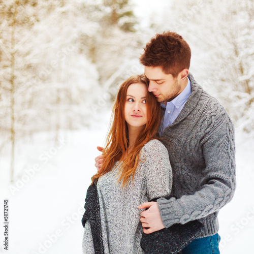 Outdoor portrait of young beautiful couple in love