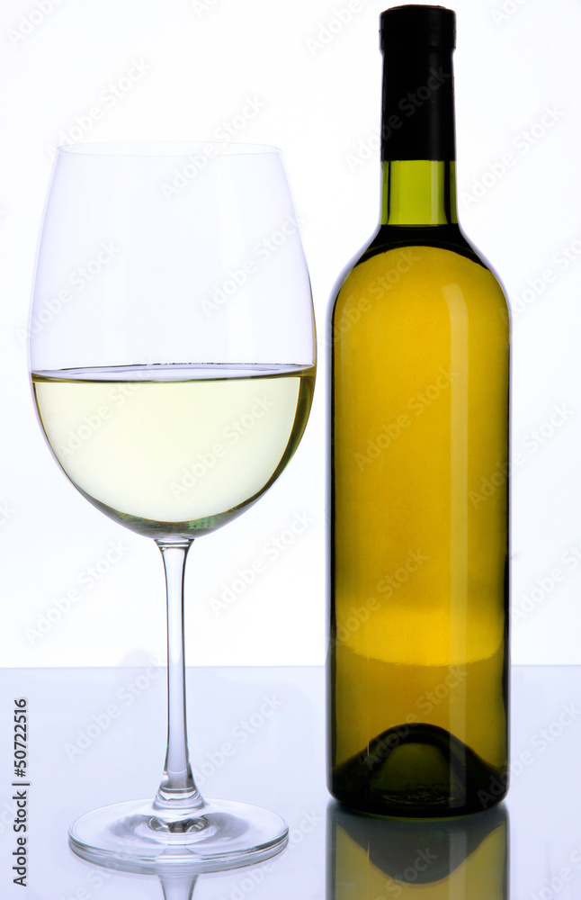 White wine glass and bottle of wine isolated on white White wine glass and bottle of wine isolated on white