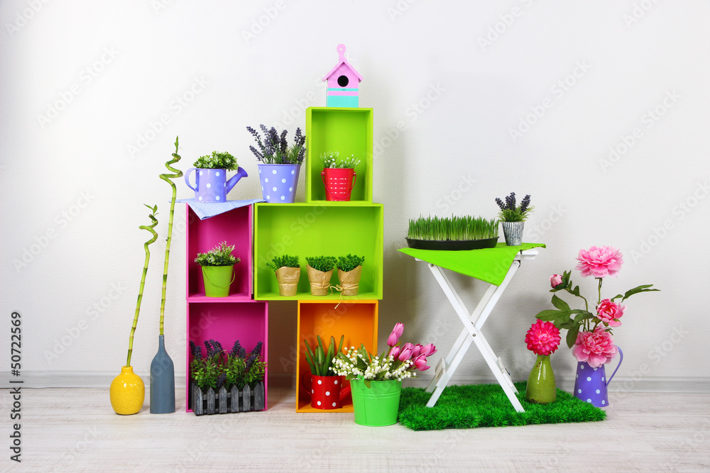 Beautiful colorful shelves with decorative elements standing in
