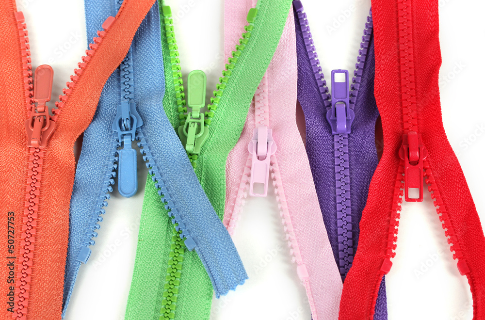 Multicolored zippers isolated on white