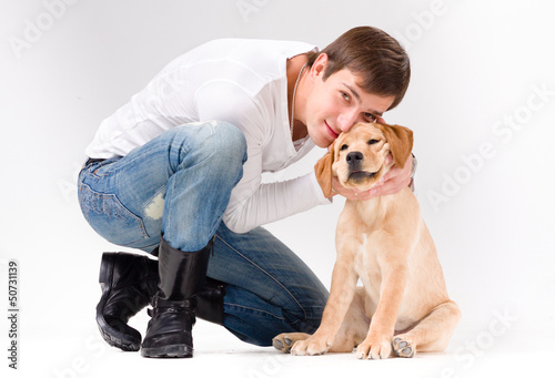 handsome man with dog over gray
