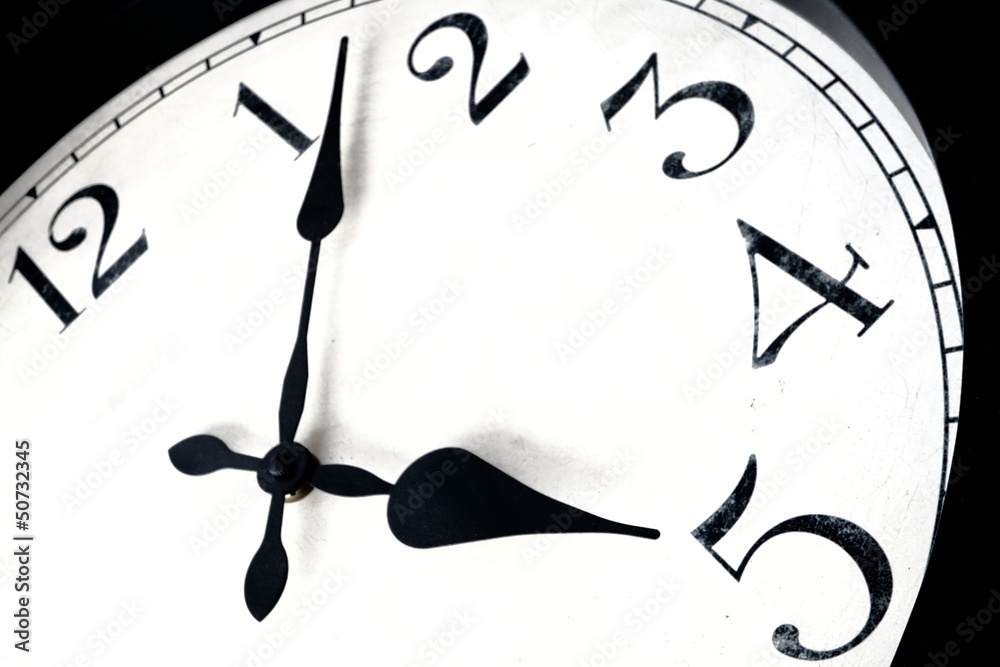 Clock face indicating concept of 'quitting time' Stock Photo Adobe Stock