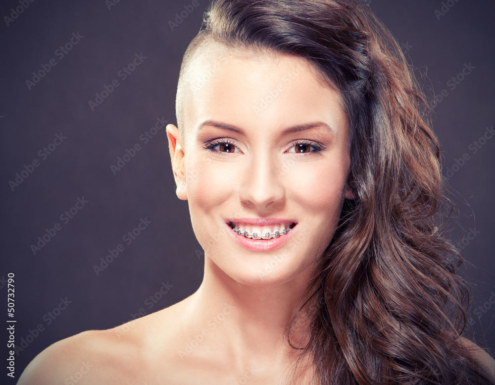 Naklejka premium Beauty portrait of a young girl with braces