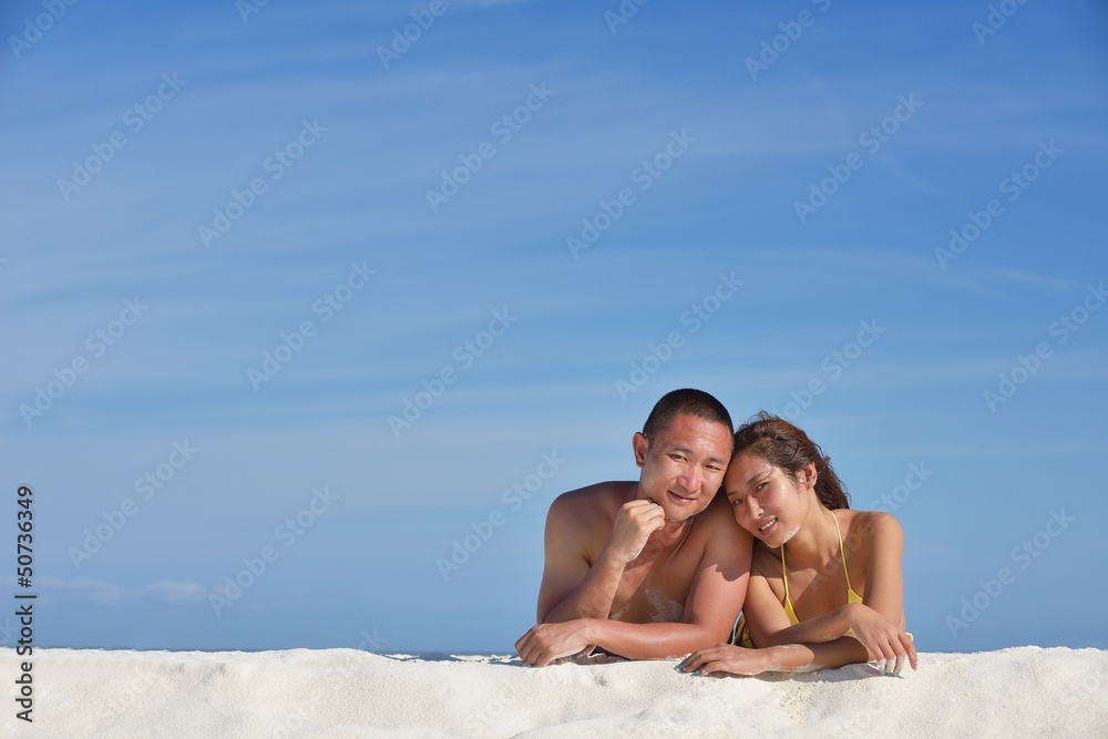 happy young couple enjoying summer on beach happy young couple enjoying summer on beach