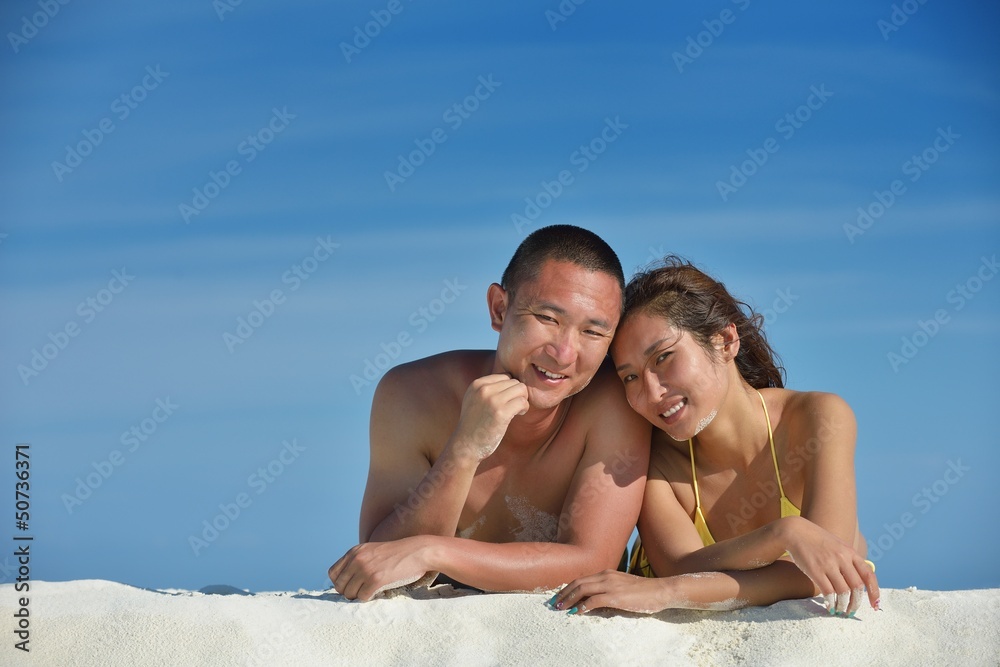 happy young couple enjoying summer on beach happy young couple enjoying summer on beach