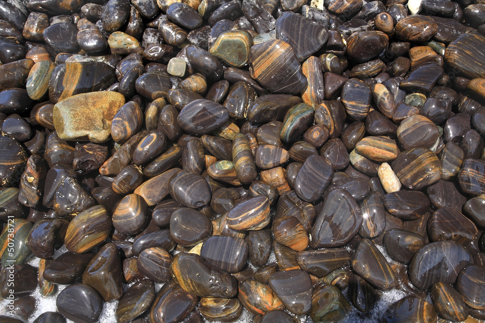 Closeup textured pattern of colorful rocks