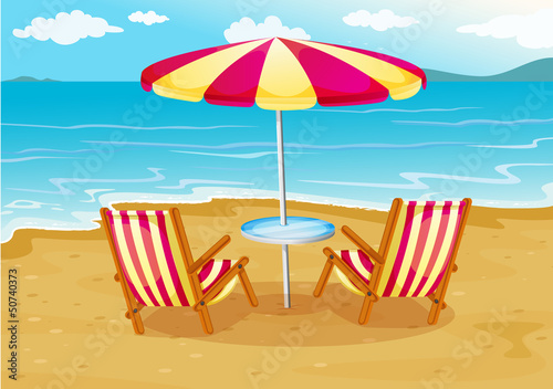 A beach umbrella with chairs at the seashore