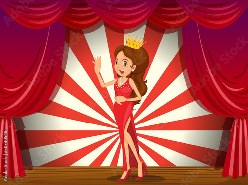 A girl wearing a crown at the stage