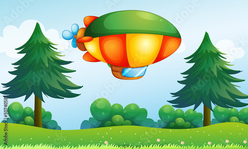 A colorful aircarft above the hill