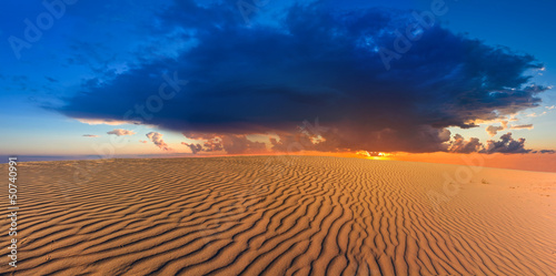 dramatic sunset among a desert