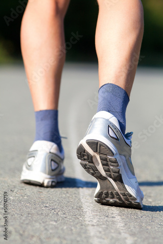 Running shoes on runner