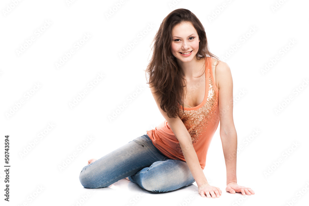 Obraz premium Attractive caucasian girl sitting on floor