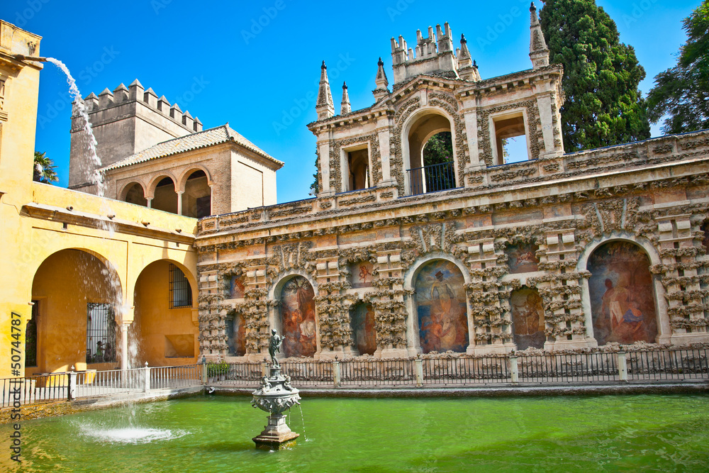 Courtyard with water pool of Alcazar,, Seville, Spain