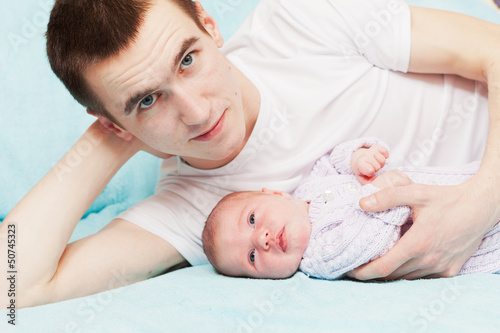 happy young father with the newborn baby