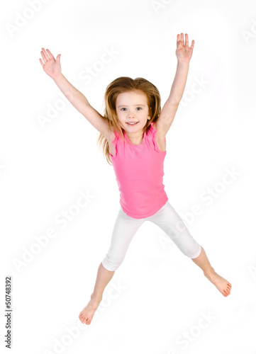 Adorable little girl jumping in air isolated