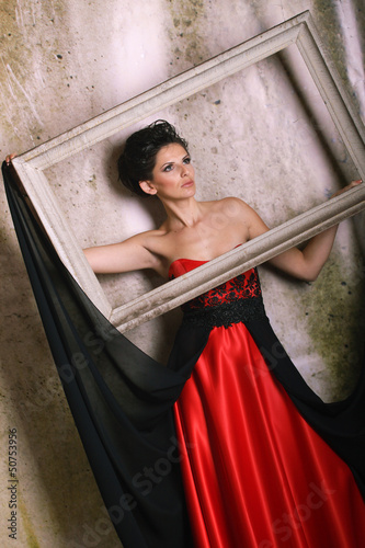 Woman in red with picture frame