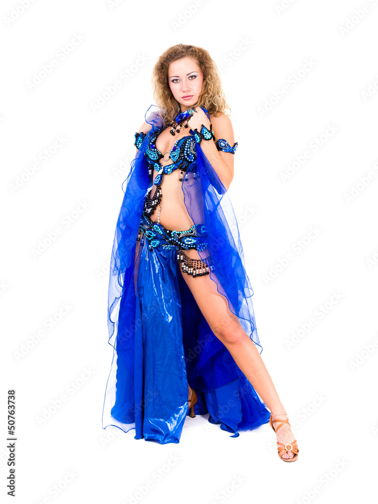 Young beautiful belly dancer in a blue costume Young beautiful belly dancer in a blue costume
