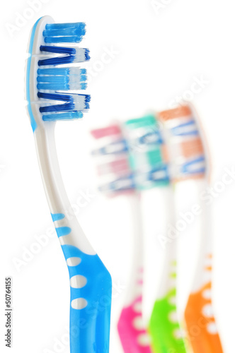 Composition with toothbrushes isolated on white