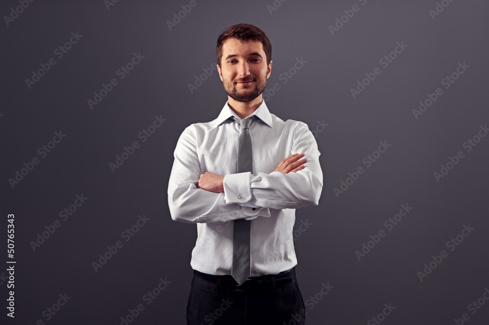 handsome businessman with folded hands