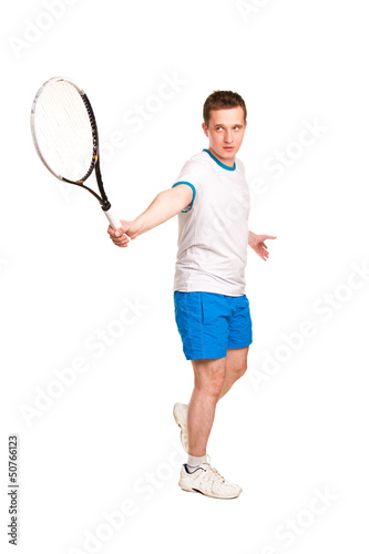 Sportive young man playing tennis