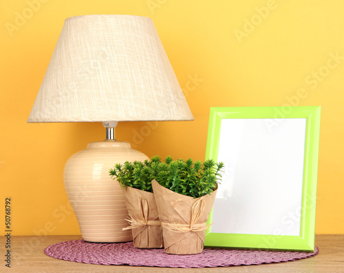 Colorful photo frame, lamp and flowers