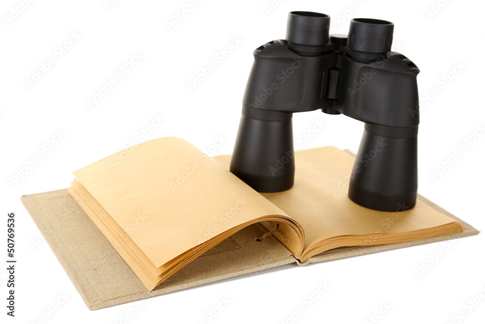 Black modern binoculars with old notebook isolated on white Black modern binoculars with old notebook isolated on white