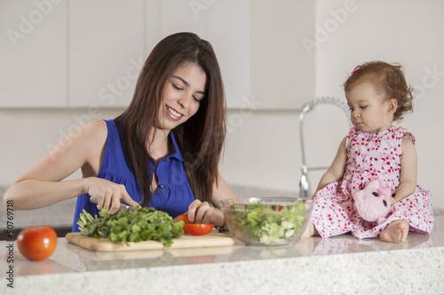 Mom and daughter making dinner