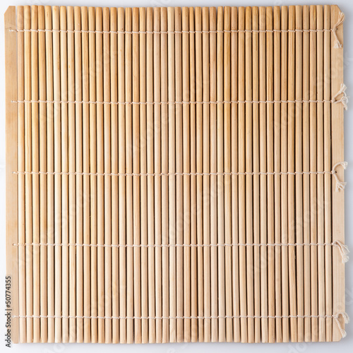 Bamboo mat for sushi. Straw colored background