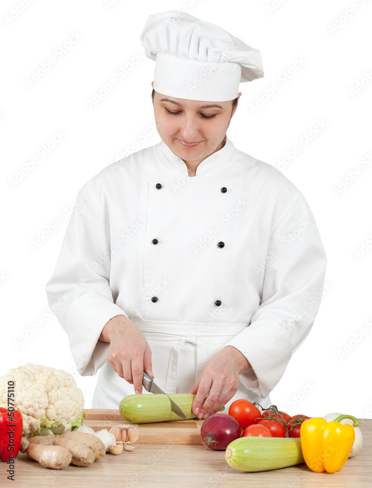 Woman chef chops vegetables for cooking Woman chef chops vegetables for cooking