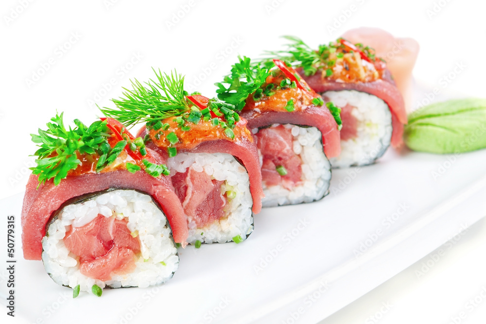 Decorative dish sushi rice salmon raw meat and spices closeup.
