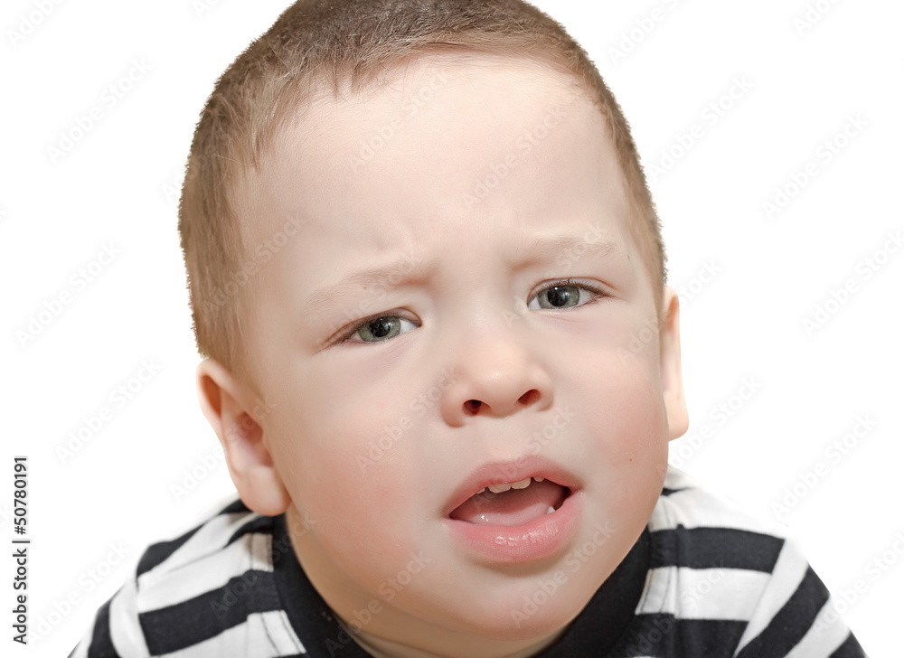 the two-year-old kid is capricious isolated on the wite the two-year-old kid is capricious isolated on the wite