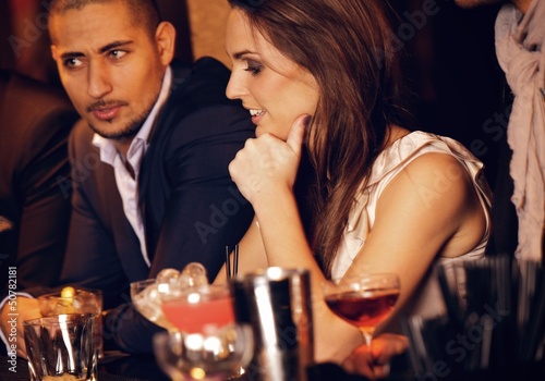 Gorgeous Woman with Boyfriend at the Bar