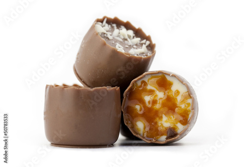 Closeup of chocolate candy assortment isolated on white.