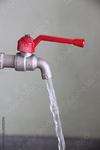 Turn on the water faucet.