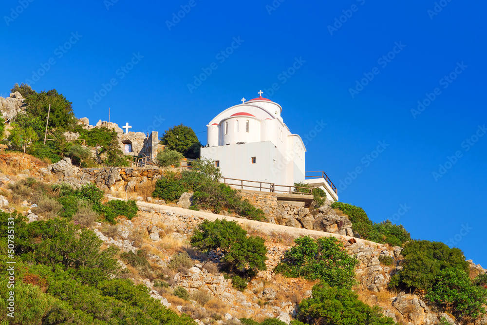 Small white church on the coast of Crete in Greece