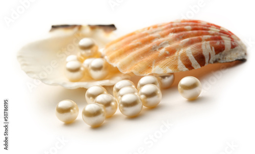 Scattering white pearls in seashell