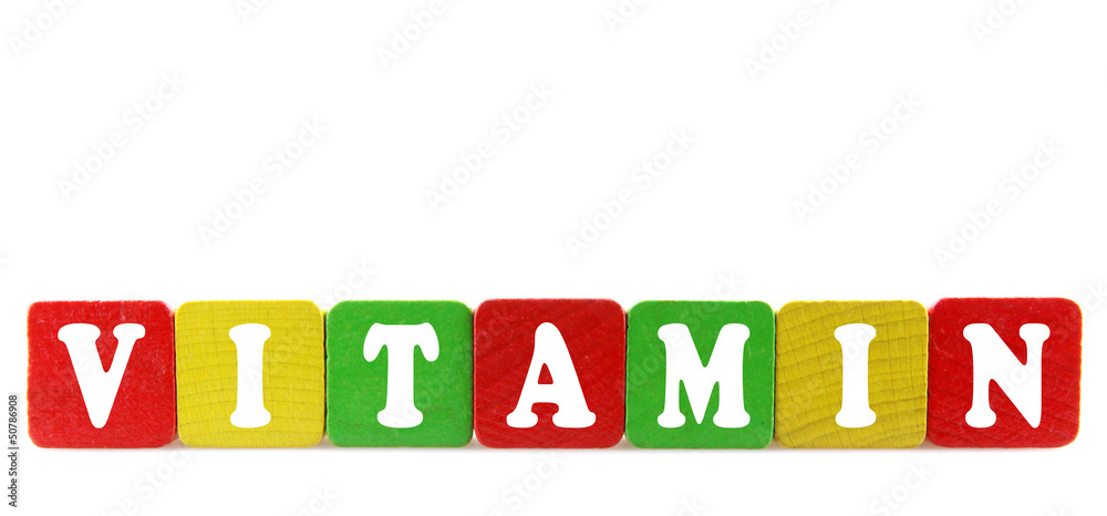 vitamin - isolated text in wooden building blocks vitamin - isolated text in wooden building blocks