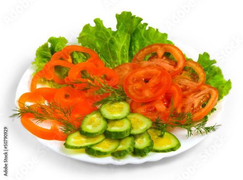 tomatoes cucumbers sliced​​ salad plate isolated on white ba