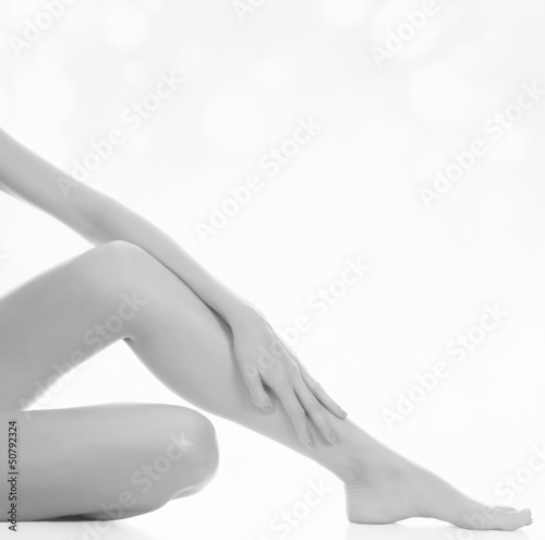 female legs after depilation  abstract blurred background