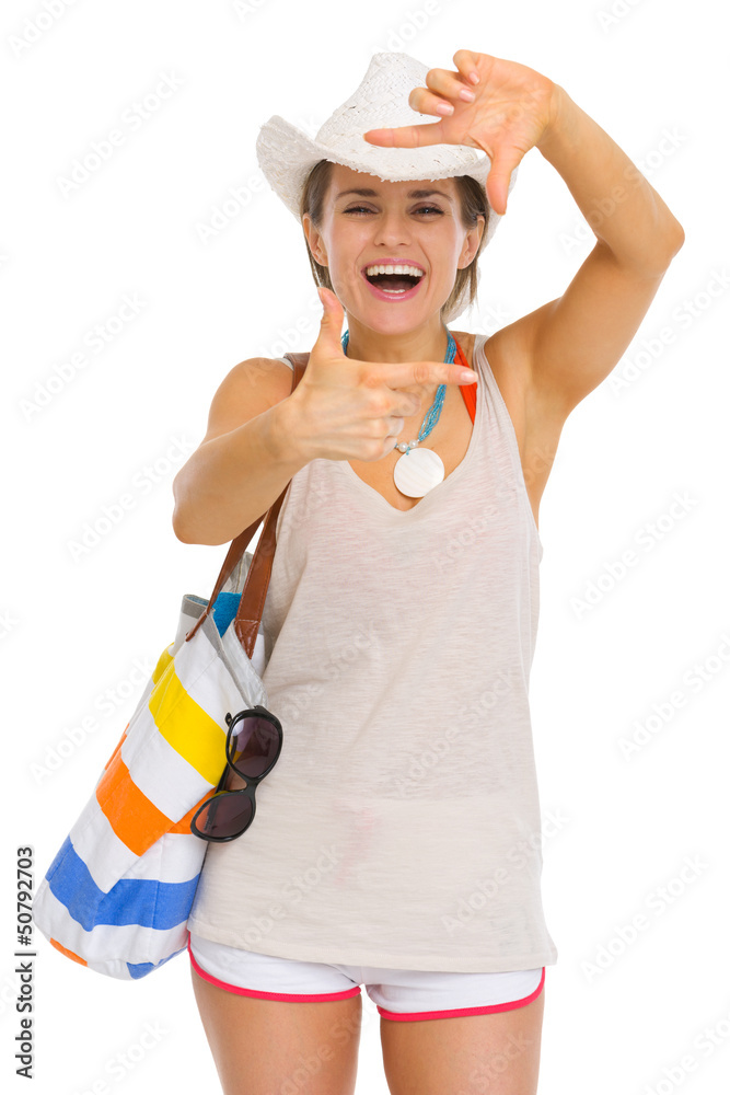 Smiling young beach woman in hat framing with hands Smiling young beach woman in hat framing with hands