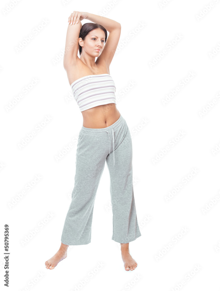 Fototapeta premium Attractive healthy young woman stretching gym, isolated on white